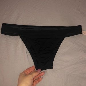 Black Victoria’s Secret bikini bottoms